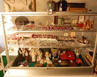 Nice selection of sterling & costume Jewelry, small bronzes, Goebels, Waterford, Ben Owens Pottery