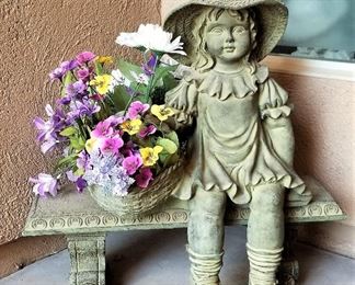 Little girl sitting on bench