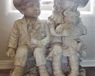Old fashioned brother and sister with teddy bear sculpture great for indoors or outdoors.
