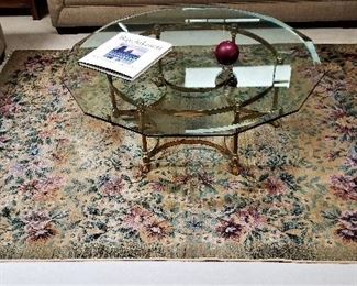 Beautiful rug for sale and 12 sided glass coffee table.