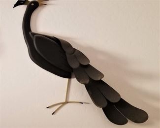 Unusual wall art. There is a pair of these black birds.