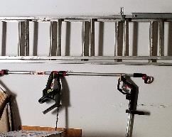 Extension ladder and other tools and smaller ladder for sale.