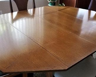 Mid-century modern table and chairs with leaves.