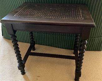 Antique end table with cane top