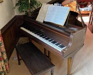 Davenport-Treacy baby grand piano, piano bench and sheet music