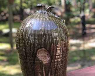 Lot 1: Edgefield Ovoid Jug, 3 Gall, some chipping on rim and a raw-exposed pottery indentation on side from either damage or a lean-to mark during making (see photos), No cracks; Markings: Two straight hash marks at bottom/body of the jar; Measuring 13" tall, 10" widest point. Purchase Price: $1,250.