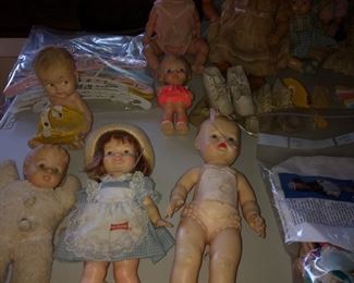 Assorted composition and rubber dolls.  Shirley Temple with outfits. 