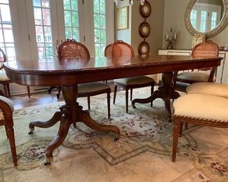 Dining table (shown with one 18” leaf), 6 side chairs and 2 captains chairs; includes an additional leaf not shown. Table (without leafs) measures 46” deep x 79” wide 