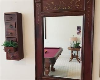 https://ctbids.com/#!/description/share/537417 Mirror with beveled edges and wall storage decor. Traditional framed mirror with beveled edge. Six drawer mini curio cabinet 20'' x 6'' x 4''.