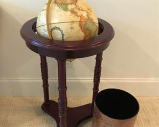 https://ctbids.com/#!/description/share/537418 ''Replogle Globes Inc'' Globe with Wooden Stand and Waste Basket. Stately world globe with solid wood stand. Accompanied by map motif waste basket.