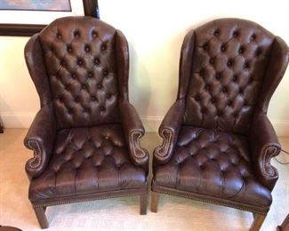 https://ctbids.com/#!/description/share/537419 Perfection of North Carolina's Leather Tufted Wingback Chairs. Pair of brown leather tufted wingback chairs. Nail-head trim on arms and front. By Perfection of North Carolina. One chair has small tear in tufting as shown in photos.