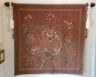 https://ctbids.com/#!/description/share/537457 Floral Tapestry with Tassels and Bar. Rust colored floral tapestry with bird on a wood bar with tassels. Tapestry measures H 51 x L 51 inches. Wood bar measures L 61 x H 3 inches.