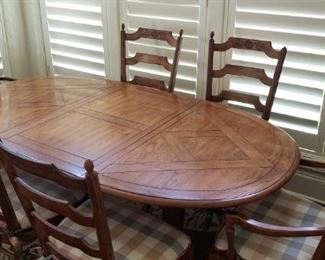 https://ctbids.com/#!/description/share/537493 Drexel Table w/ 6 Chairs & Leaf. Drexel table is oak. The main photo of the table includes one leaf and measures 75" long without the second leaf, 41" wide, and 29" in height. There are two chairs with arms and 4 other dining chairs. The chairs measure 42" tall from floor to the highest point, 17" from floor to the seat, and the width of the seat is 21.5". The second leaf measures 41" long and 22" wide.