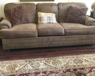 https://ctbids.com/#!/description/share/537497 Three Cushioned Soft Couch with Pillows. Measures 93 inches by 41 inches and 36 inches tall. 4 pillows, 2 of which match.