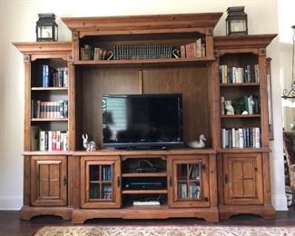https://ctbids.com/#!/description/share/537502 Media and Entertainment Wall Unit. Beautiful pine millwork adorns this rustic over-sized media wall unit. Overall height 94'', width 124'', depth 20'' . (Accommodates TV dimensions 66'' x 40''). Note contents and equipment shown in photos is NOT included. Some items maybe sold in separate lots.