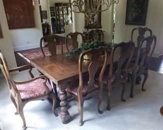 https://ctbids.com/#!/description/share/545034 Handcrafted in Scotland-Dining Room Table and Chairs. *Reserve of $500* Very special handcrafted table and chairs from Scotland. Table extends to seat 12 people. Legs were hand-turned. Eight upholstered chairs are included. You can find 2 more coordinating chairs with legs that match the table in lot D106. Without extensions, the table measures 79" x 39.25" and is 29" high. Each extension is approximately 18" wide. Chair in last picture on the left is not included. That is included in lot D106.