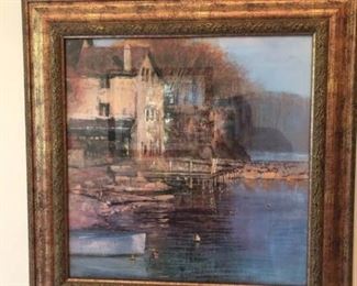 https://ctbids.com/#!/description/share/537347 Elegant Gold Framed Water Scene Print. Colors of gold and blue are depicted in this gold framed print of a rustic building and dock by the water. Overall dimensions 32'' square. No artist's name found.