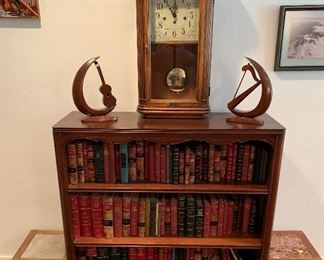 The clock and all the leather bound books are sold.