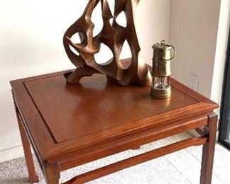 The wood sculpture and brass lantern are sold.