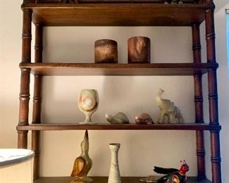 The shelving, two wood cups and the colorful bird are sold.