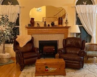 Leather recliners and boxed storage tables, artificial Tree with lights, wooden carved owls and birds 