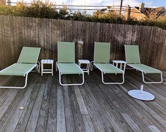 lounge chairs and three side tables