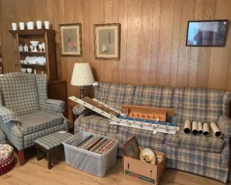 Sofa, chair and ottoman, albums, prints, wall hanger organizers