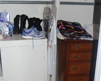 2 cabinets in the closet, nice tennis shoes and blankets