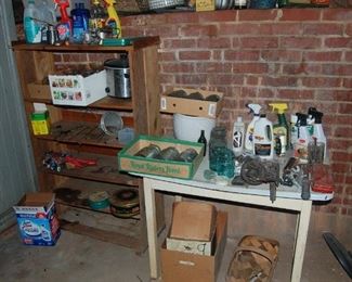 blue jars, enamel top table with a cherry pitter still attached