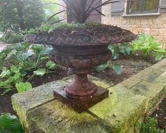Pair of cast iron planters $750