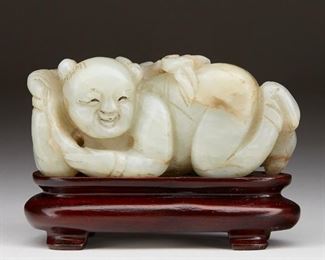 LOT 272: EARLY QING CHINESE CARVED JADE FIGURE OF A BOY