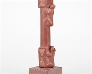 LOT 379: NATIVE AMERICAN CATLINITE BEAR CHASING MAN CANDLESTICK