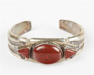 LOT 386: SOUTHWESTERN STERLING SILVER BRACELET W/ RED GEMSTONE
