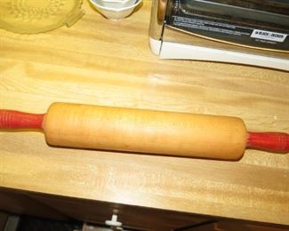 VINTAGE RED HANDLE ROLLING PIN.
