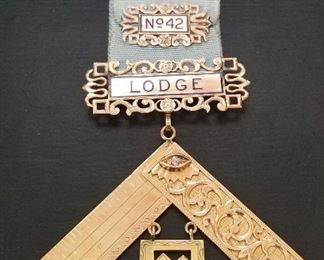 St. George Lodge No. 42 Masonic pin. Top portion 14k Gold, bottom portion 10k Gold with round diamond melee. Presented to "name on back" 1934. Complete with appraisal letter.