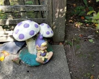Gnome and mushrooms garden statue