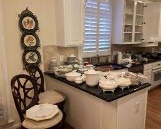 bar stools, white dinnerware, kitchen items