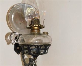 Antique oil lamp with wall bracket and reflector