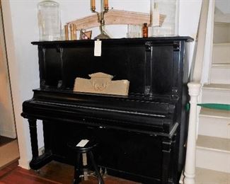 Black antique upright piano