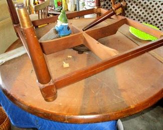 Mahogany or teak table. One leg needs re pegged and glued