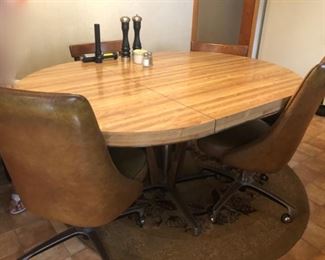 Vintage table with rolling chairs 