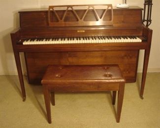 Lower Level:  A "Grand" brand console piano and bench are priced to sell!