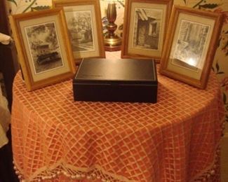 Bedroom #3:  Four individually priced black/white photos flank a small brass lamp and leather case.  The coral beige topper/tablecloth and table are priced as a set.
