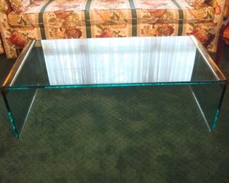 Living Room:  This mid-century "waterfall" glass and brass table measures 51" wide.