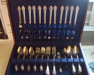 Dining Room:  A 68-piece set of ONEIDA silver plate flatware includes service for 12 (dinner forks; dinner knives; dessert forks; tablespoons; teaspoons [18]; one sugar; one butter knife) and its chest.   