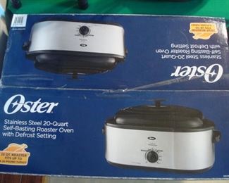 Kitchen:  A brand NEW OSTER 20-Quart roaster oven.
