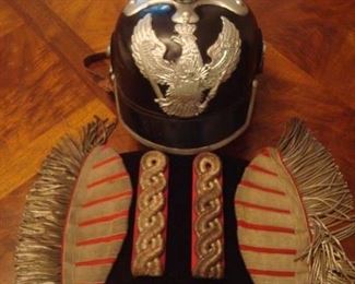 Near Cashier:  A Prussian (German) guard helmet (Pickelhaube) is priced separately from the set of WWII German Army Musician Leader Swallow Nest epaulets AND set of shoulder boards.  The "Swallows Nests" were attached to the shoulders of Army Tunics and were worn by all Band Members. The longer gold bullion fringe indicates rank and a leadership position in the group.  Closer photos of the helmet follow. (Note:  the epaulets' "fringe" is actually fine chain metal; the shoulder boards' threads are also made of fine metal threads.)
