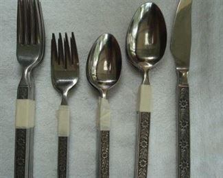 Sun Room:  Mid-century flatware includes 6 dinner forks; 8 salad/dessert forks; 8 tablespoons; 13 teaspoons; 8 knives; 1 sugar spoon; and one butter knife, for a total of 45 pieces.