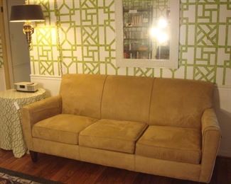 Family Room:  An 80" fawn color/ultra-suede-like FLEX-STEEL sofa is in great condition!  It has a tight back and three removable seat cushions.  The brass hanging light with black shade, table, BOSE WAVE radio, and mirror are also for sale.  A few closer photos are coming up.