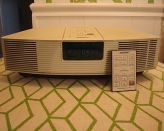 Family Room: The white, vintage  BOSE WAVE radio (Model AWR1-1W) includes its remote which will be with the cashier.   